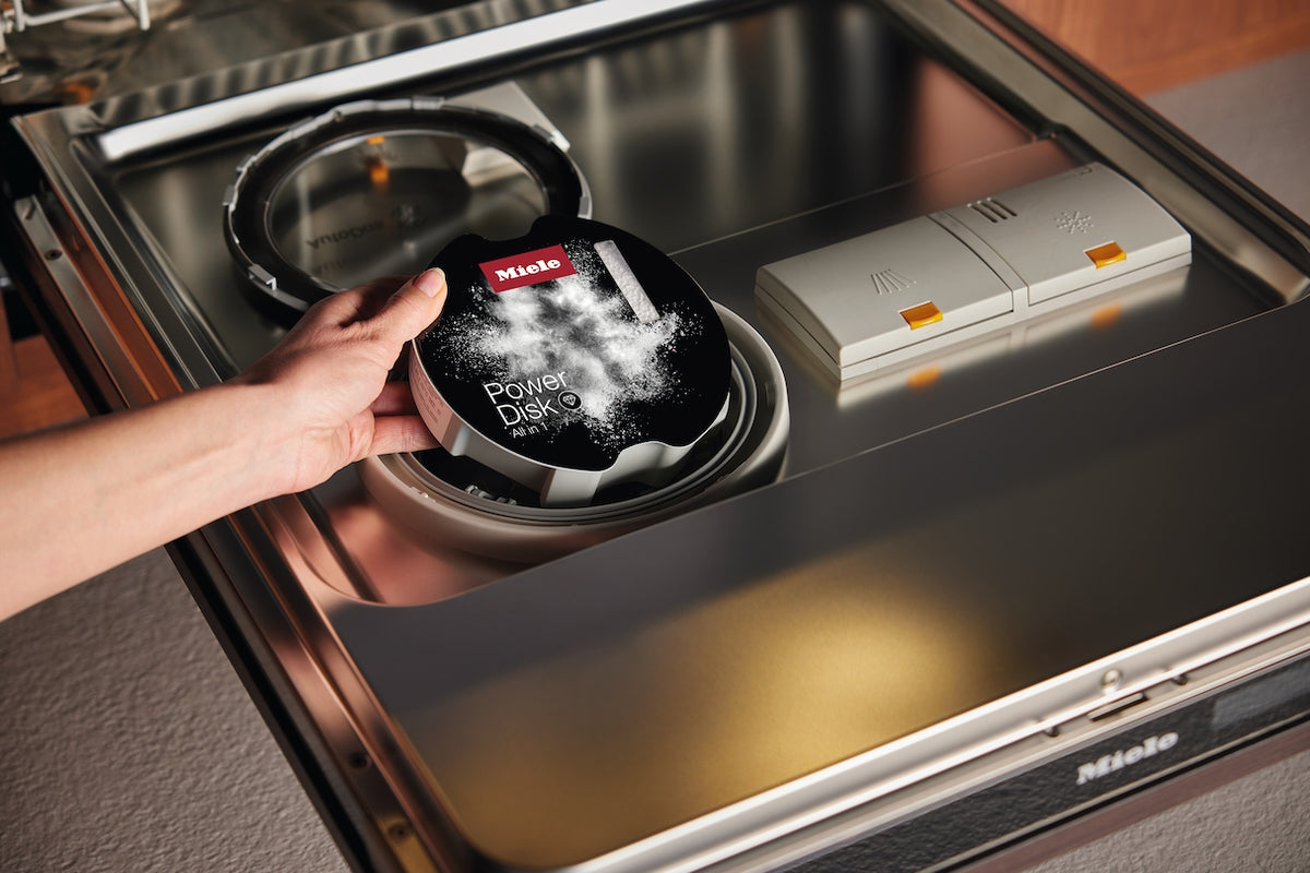 Loading a Miele PowerDisk into an AutoDos dishwasher