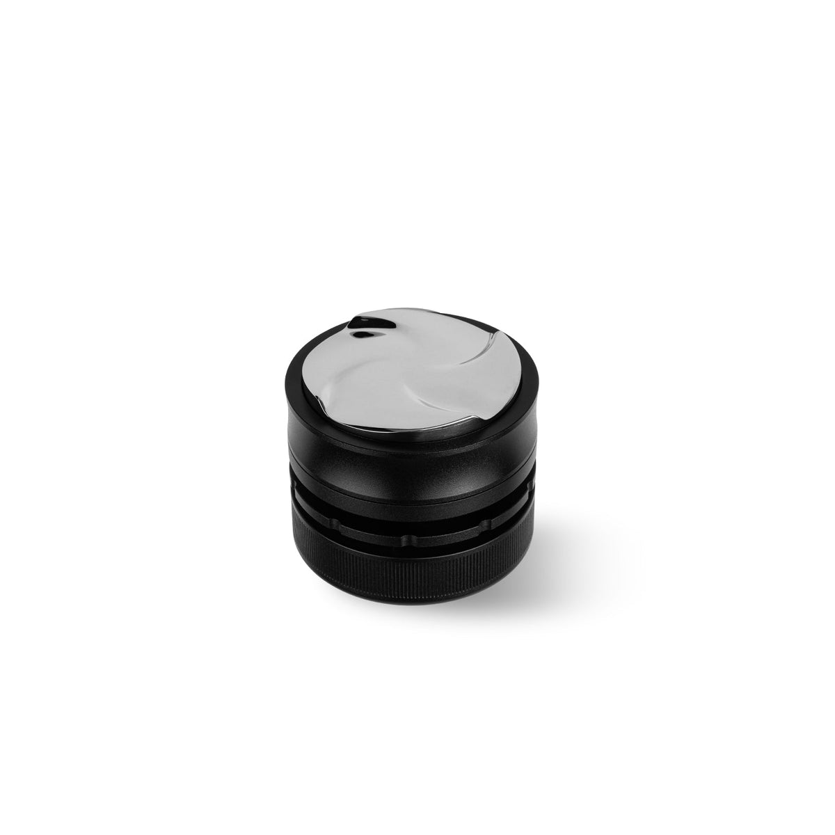 A black cylindrical MHW-3BOMBER Coffee Gravity Distributor 58.35mm with a cyclone-shaped base and silver, wave-patterned lid, shown on a white background.