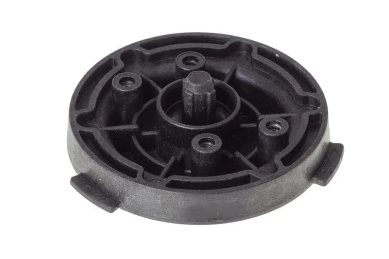 The DeLonghi Parts: Brewing Gasket Support (model 5313267131) by DeLonghi is a sleek, black plastic circular component featuring a central raised spindle and four evenly spaced screw holes. Its symmetrical design includes two small tabs on the outer edge, ensuring a perfect fit and function for the La Specialista machine.