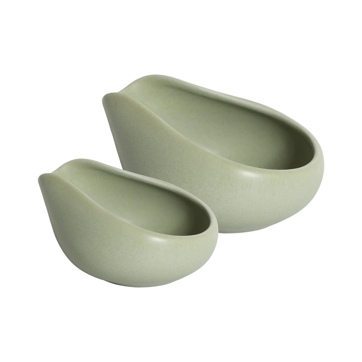 Two matte light green Loveramics Coffee Dosing Trays, crafted in smooth ceramic with curved, asymmetrical edges and a clean, modern aesthetic, nest side by side on a white background.