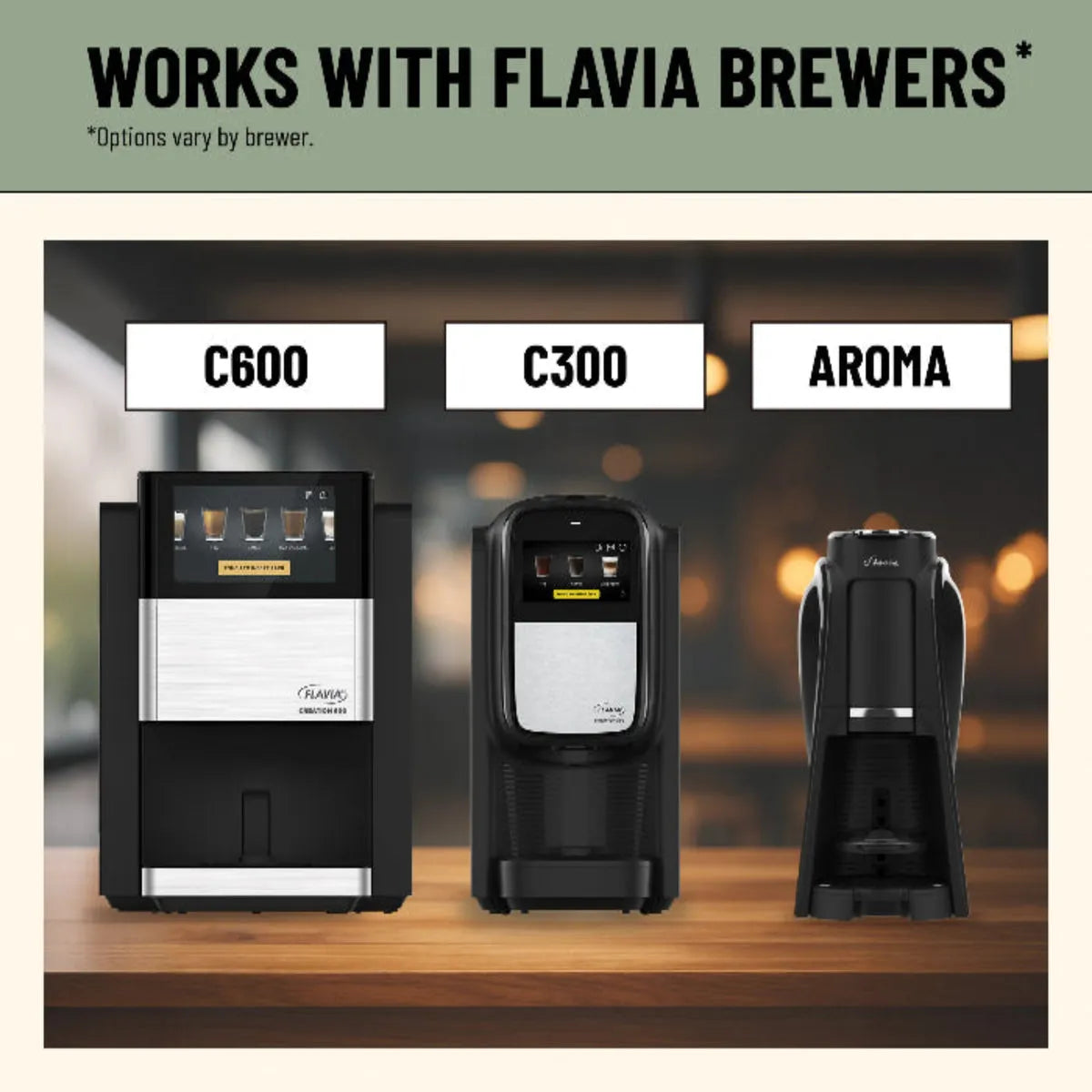 Three Flavia coffee brewers (C600, C300, Aroma) are shown side by side on a countertop. The text says "Works with Flavia Brewers*" and features Lavazza Decaf Medium Roast Coffee Freshpacks (Case of 76). *Options vary by brewer.