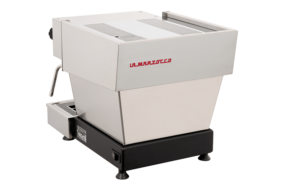The La Marzocco Linea Mini R Dual Boiler Semi-Automatic Espresso Machine in brushed stainless steel rests on a sleek black base, showcasing a left-side steam wand and a minimalist, modern design set against a plain white background—an ideal choice for aspiring home baristas who want commercial-grade performance.