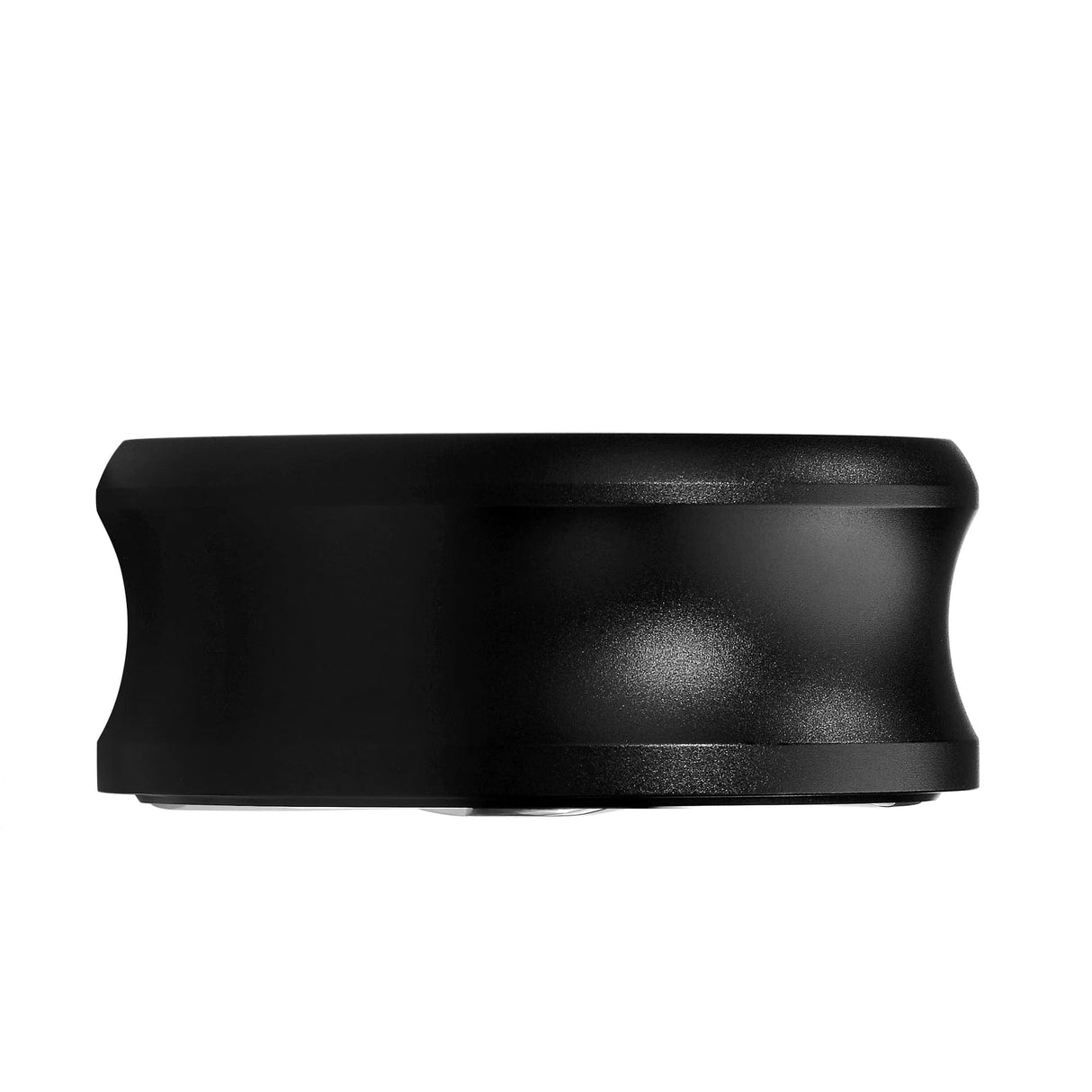 Normcore Gravity Distributor Tool (58.5mm) by Normcore, shown in black with a cylindrical shape, wavy contour, and matte finish. The tool features smooth edges and is photographed against a white background, making it ideal for use with 58.5mm portafilters.