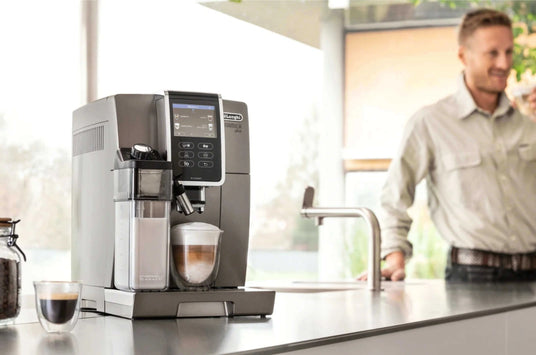De'Longhi espresso machine with latte and smiling man