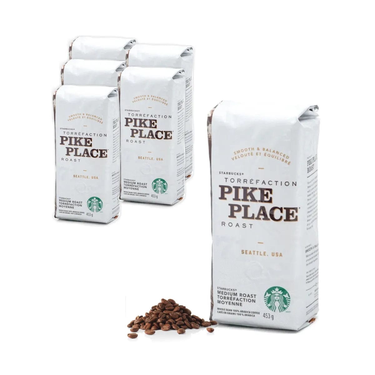 Six packages of Starbucks Pike Place Roast Coffee Beans (Case of 6x 1lb) are arranged on a white background. Five packages are standing together behind a single package in the foreground, with coffee beans scattered near the front.