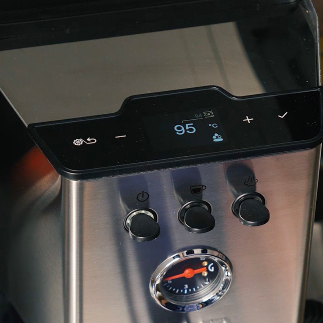 Close-up of the Gaggia Classic UP Semi-Automatic Espresso Machine EG2500/00 control panel with a digital dual PID display reading 95 degrees, three circular push buttons, and an analog pressure gauge.