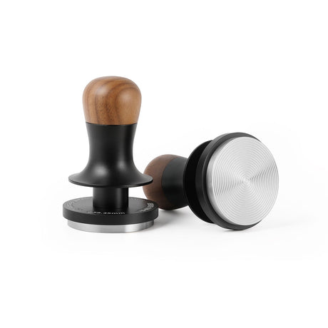 Two coffee tampers, including the MHW-3BOMBER Flash Tamper 30lbs Constant Pressure Espresso Tamper 2.0 Sound Feedback with Ripple Base (Walnut), are shown on a white background—one upright and one on its side.