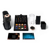 Image of a Nespresso Vertuo Next Premium Coffee and Espresso Machine set by De'Longhi. The set features a sleek black Vertuo Next coffee machine with rose gold accents, Centrifusion Extraction Technology, an assortment of colorful coffee pods, a water container, a used capsule container, a drip tray, an Aeroccino milk frother, a quick-start guide, and an informational booklet.
