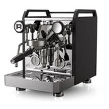 The Rocket Mozzafiato Fast Type R Espresso Machine RE852E3B12 (Black) by Rocket features stainless steel design, black side panels, pressure gauges, portafilter handle, and Rapid Heat-Up Technology for an enhanced brewing experience.