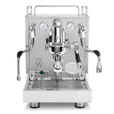 The ECM Mechanika Max Heat Exchanger (HX) Espresso Machine with PID by ECM features a stainless steel finish, dual gauges, two side steam wands, control buttons, and a drip tray beneath the group head, all visible in its front view.
