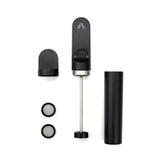 A disassembled handheld coffee press with a black handle, plunger, two round filters, and a cylindrical container rests on a white background—ideal to use with the Subminimal V2 NanoFoamer (Black) for creating microfoam for latte art.
