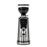 The Bellucci Preciso Mini Coffee Grinder (Stainless Steel) features a digital display, transparent bean hopper, front control buttons, and 64mm flat burrs for precise espresso grinding. "Bellucci" is displayed at the base.