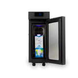 The Bellucci Milk Fridge 2.6L (Black) by Bellucci is a compact black milk fridge shown with its door open, displaying a digital temperature of 25°C. Inside, a blue and white milk carton rests on the shelf in front of the integrated cooling fan. With convenient touch screen temperature control, this fridge is an ideal addition to any commercial espresso station.