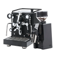 The Quick Mill Rubino Espresso Machine (Black) & Eureka Mignon Zero 65 All Purpose Grinder (Black) Bundle by Quick Mill features a sleek espresso machine with dual spouts and a steam wand alongside the versatile single-dose grinder, both elegantly displayed on a white background.