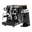 The Quick Mill Rubino Plus Espresso Machine (Black) & Eureka Mignon Zero 65 All Purpose Grinder (Black) Bundle from Quick Mill features a sleek black espresso machine with silver accents alongside a matching all-purpose grinder with a wooden top, both displayed on a white background—ideal for preparing fresh single-dose espresso.