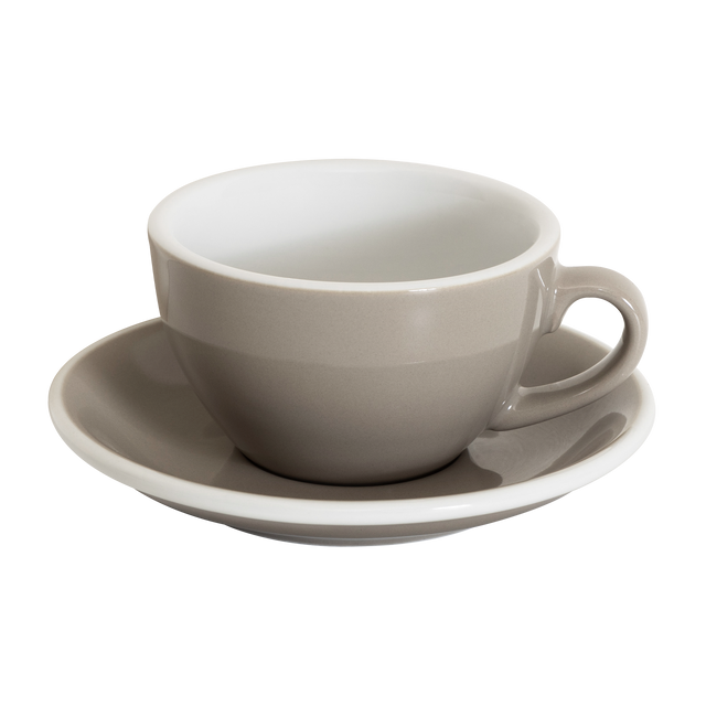 A Loveramics Egg 200ml Cappuccino Cup with handle, in taupe, rests on its matching saucer against a white background, reflecting the style of the World Latte Art Championship cup.