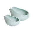 Two celadon blue, glossy ceramic trays with rounded shapes and wide, slanted openings from Loveramics are placed side by side on a white background. Reminiscent of a refined porcelain coffee accessory featured by James Hoffmann, the Loveramics Coffee Dosing Tray Set of 2 showcases one larger and one smaller tray appearing neatly nested together.