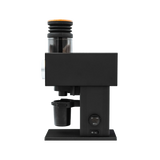 Side view of the DF Grinders CF64V Variable Speed Single Dose Coffee Grinder with DLC Burrs (Black), showroom unit, featuring a cylindrical bean hopper, cup holder, and power switch, set against a plain white background. In store pickup only.