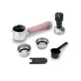 Enhance your DeLonghi Dedica Duo Espresso Machine with Cold Brew EC890PK (Rosé) using a pink-handled portafilter, tamper, two filter baskets, scoop, and cleaning tool—ideal for espresso making or My LatteArt technology.