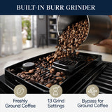 Coffee beans being poured into the built-in conical burr grinder of the DeLonghi Magnifica Start Super Automatic Espresso Machine with LatteCrema System ECAM22080SB (Silver), with icons and text highlighting features such as freshly ground coffee, 13 grind settings, a bypass for pre-ground coffee, and the innovative DeLonghi LatteCrema System for deliciously creamy milk beverages.