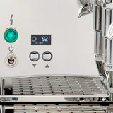 Close-up of the ECM Technika VI Dual Boiler Espresso Machine's control panel by ECM, featuring a green indicator light, on/off switch, arrow buttons, digital PID display at 92°C, and part of the shiny drip tray and portafilter.