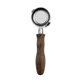 The HCS Bottomless Portafilter (Brown Wood) features a round stainless steel head and a wooden handle, resembling a metal mesh strainer, displayed against a plain black background.