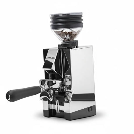 The Eureka Mignon Zero 65 All Purpose Grinder by Eureka features a chrome finish, a portafilter handle, and a transparent hopper filled with coffee beans, all set against a plain white background.