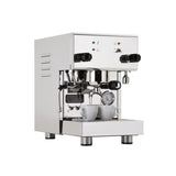 The stainless steel Profitec Pro 300 Dual Boiler PID Espresso Machine features dual knobs and a precise gauge in front. Two small white cups sit on the drip tray, with a steam wand ready on the side.