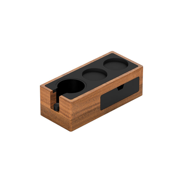 The MHW-3BOMBER Bar Station Organizer Kit Bundle features three circular black slots, ideal for holding portafilters or tampers. Its minimalist, smooth wooden design combines style and functionality for your coffee setup.