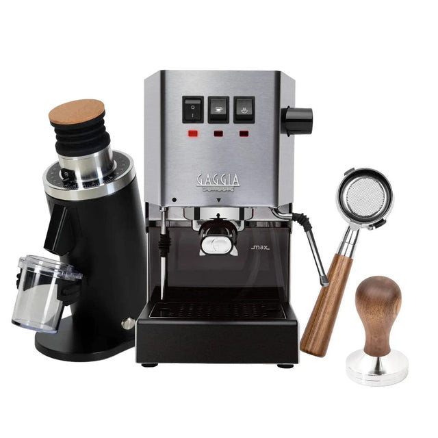 A Gaggia Classic E24 Stainless Steel coffee setup includes a DF54 black grinder with a transparent bean container, along with a bottomless walnut portafilter and tamper—beautifully displayed on a white background.