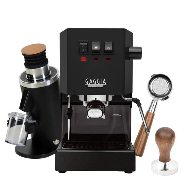 The Gaggia Classic E24 Thunder Black, featuring the DF54 (Black) Grinder with a clear container, is showcased against a white background. This bundle includes a Bottomless Walnut Portafilter with stainless steel construction and a Walnut Tamper, all elegantly displaying the Gaggia logo.