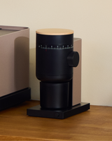 Fellow Opus 2 Conical Burr Grinder in malted chocolate with maple lid, angled view