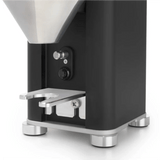 Close-up of the lower section of the Rocket Giannino Coffee Grinder R01RG099B3A12 by Rocket (Black-Stainless Steel), showcasing its flat metal base, control switches, sturdy metal feet, and precise micrometric grind adjustment.