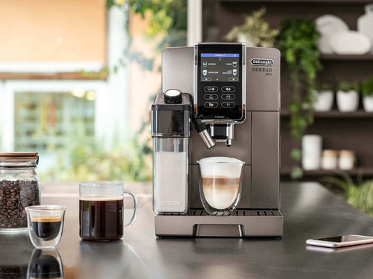 DeLonghi coffee machine making latte - affirm lifestyle