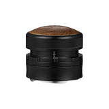The MHW-3BOMBER Coffee Gravity Distributor 58.35mm features a black metal and wood design with a rounded wooden top, cyclone-shaped base, and side measurement markings, shown isolated on a white background.