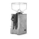 The Eureka Mignon Design Coffee Grinder (Stone) by Eureka features a gray, stone-textured body, transparent square hopper, digital display, and portafilter holder. This Italian grinder stands out against a white background.