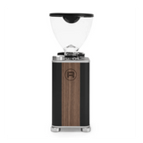 The Rocket Giannino Coffee Grinder R01RG099B3L12 (Black-Wood) by Rocket features a clear bean hopper, black and wood-paneled body, silver accents, micrometric grind adjustment, and a circular front logo, shown on a white background with black border.