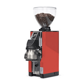A red Eureka Mignon Libra 65 All Purpose Grinder by Eureka, with a clear hopper of coffee beans, digital display, precise grind size control, and a stainless steel base container—shown on a white background.