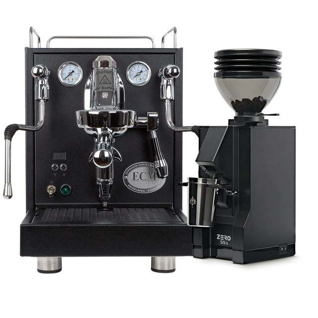 An ECM Mechanika Max Espresso Machine (Black) and a Eureka Mignon Zero 55s Single Dose Coffee Grinder (Matte Black) from ECM are elegantly displayed as a bundle on a white background, with the grinder filled with fresh coffee beans and the machine featuring dual pressure gauges.