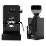 A Gaggia Classic E24 Black & Eureka Mignon Zero 55s Single Dose Coffee Grinder (Matte Black) Bundle by Gaggia is displayed against a plain white background. The grinder holds coffee beans visible in the hopper, and the espresso machine features a lead-free brass boiler for high-quality brewing performance.