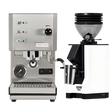 A Profitec Go (Stainless Steel) Espresso Machine with gauges and buttons is positioned next to a white Eureka Mignon Zero 55s Single Dose Coffee Grinder, both branded by Profitec and labeled "ZERO 555." The set includes a portafilter and grind catcher, all displayed on a plain white background.