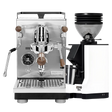 The Profitec Jump Espresso Machine, featuring a stainless steel heat exchanger and stylish wooden handles, is paired with the modern Eureka Mignon Zero 55s Single Dose Coffee Grinder in white. Both sit elegantly on a white background, while the machine’s multifunction switch streamlines espresso extraction for consistently perfect results.