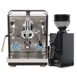 A Profitec Ride Espresso Machine in black and stainless steel is shown alongside a Eureka Mignon Zero 55s Single Dose Coffee Grinder in matte black, with a clear hopper filled with coffee beans.