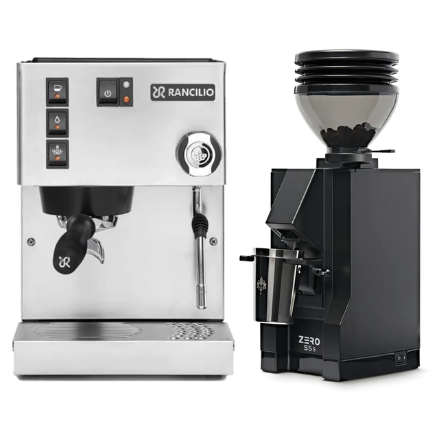 The Rancilio Silvia M V6 Espresso Machine in silver stainless steel, paired with the Eureka Mignon Zero 55s Single Dose Coffee Grinder in matte black, sits against a white background. This stylish bundle by Rancilio promises consistent espresso extraction for your perfect cup.