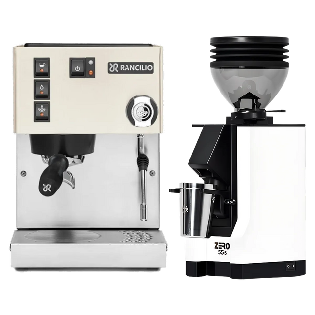 A Rancilio Silvia M V6 Espresso Machine (White), constructed with stainless steel and equipped with buttons, a vibratory pump, and a steam wand, sits beside a matching Eureka Mignon Zero 55s Single Dose Coffee Grinder (White) from the Rancilio brand, both displayed on a plain background.