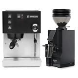 A Rancilio Silvia M V6 Espresso Machine (Limited Edition Black and Stainless Steel) sits next to a Eureka Mignon Zero 55s Single Dose Coffee Grinder in Matte Black, both from Rancilio, displayed on a white background.