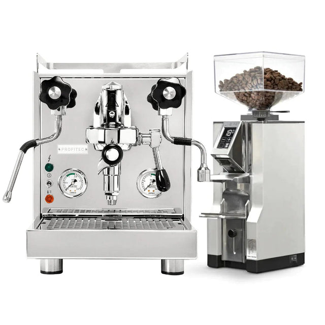 The Profitec Pro 500 Espresso Machine, featuring a stainless steel build with an E61 group head, steam wand, and pressure gauges, is paired with the modern Eureka Mignon Libra Grinder in a sleek chrome finish that includes an electronic display. Both items are showcased against a plain white background.