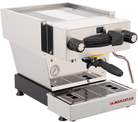 The La Marzocco Linea Mini R Dual Boiler Semi-Automatic Espresso Machine in brushed stainless steel features dual black knobs, a steam wand, a pressure gauge, and a portafilter handle. With its commercial-inspired design and the “La Marzocco” brand name displayed on the lower front panel, it’s perfect for any home barista.