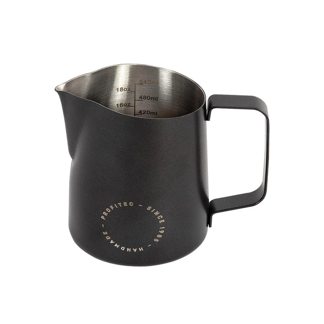 The Profitec Milk Frothing Pitcher 550ml (Matte Black) features a sturdy handle, a precise spout, and interior measurement markings in both milliliters and ounces—perfect for accurate pouring and crafting impressive latte art. Its matte black exterior is accented by a circular “Profitec Handmade Since 1985” logo near the base, showcasing the brand’s commitment to quality craftsmanship.