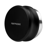 The Normcore Gravity Distributor Tool (58.5mm) by Normcore is a black metal coffee distribution accessory, distinguished by its round flat top and metallic edge with the brand name “normcore” inscribed on it. Displayed against a white background, this gravity distributor tool is designed specifically for 58.5mm portafilters to ensure even and consistent coffee grounds, helping you achieve the perfect espresso shot every time.